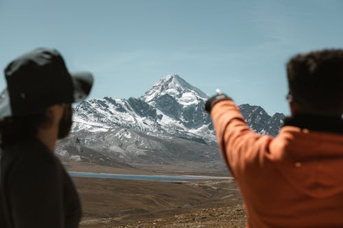 Free Man Pointing on Huayna Potosi Stock Photo