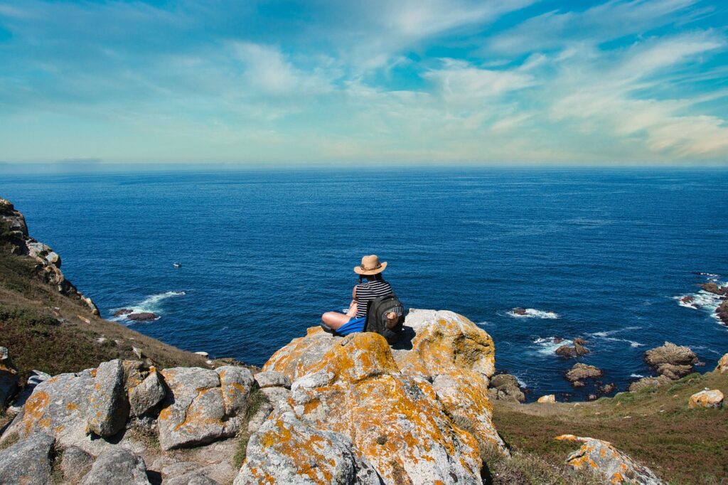 sea, cliff, hiker-6580562.jpg